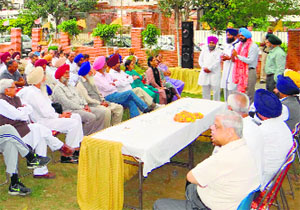 SAD-BJP candidate Manpreet Singh Ayali addresses a public meeting at Vikas Nagar in Ludhiana on Friday.