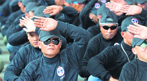 Pro-government Thai Red Shirt supporters practice self-defence as they attend a Democracy Protection Volunteers camp in Udon Thani province.