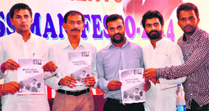 Girish Chodankar, AICC secretary and NSUI in-charge (second from left), releases Congress manifesto along with NSUI leaders at the Gandhi Bhawan, PU, on Saturday.