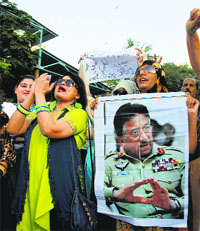 Supporters of Musharraf chant slogans in his support in Karachi on April 2. AP