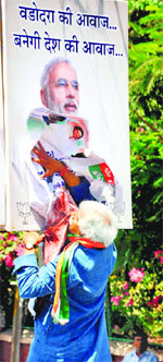 Vadodara Congress candidate Madhusudan Mistry was detained for pasting his poster over that of Narendra Modi in the city. PTI