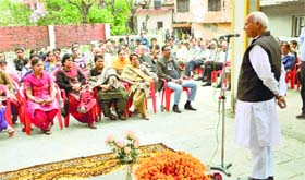 Congress candidate Chander Kumar addresses a public meeting at Dharamsala on Saturday.