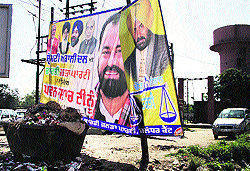 An election hoarding of the SAD-BJP put up illegally at Sabji Mandi, Jalandhar Cantt