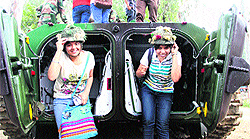 Girls deck up in Army gear strike a pose
