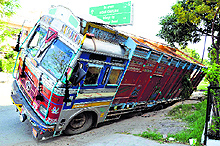 A truck got stuck when road caved in near Dhami Horpital, Kitchlu Nagar, in Ludhiana on Saturday