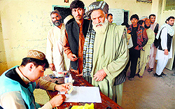 Afghans exercise their franchise at a polling station in Herat on Saturday