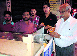 Raju sells gol gappas to his customers at Dhobi Bazar in Bathinda on Sunday