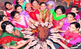 Women activists of the BJP celebrate the party's foundation day in Haridwar on Sunday