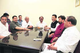 Chaudhary Lal Singh ( in red jacket) with senior Congress leaders at the Congress Bhavan in Dehradun on Saturday
