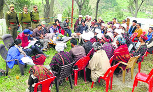 A German team holds an interactive session with shepherds of the Gujjar community at Sahoo in Chamba on Sunday