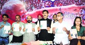 BJP leaders release a special issue of the "BJP Update" in Jammu on the party's foundation day on Sunday