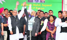 PDP patron Mufti Mohammad Sayeed along with party candidate for the Jammu-Poonch seat Yashpal Sharma during a public meeting in Jammu on Sunday
