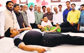 Residents donate blood at a camp organised by the Niswarth Sewa Society in Ludhiana on Sunday.