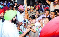 Capt Amarinder Singh meets party workers during an election rally in support of his wife Preneet Kaur in Patiala on Sunday