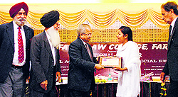Justice GS Singhvi (retd) honours a newly appointed PCS (judicial) officer in Faridkot on Saturday