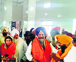 SAD candidate from Anandpur Sahib Prem Singh Chandumajra with his supporters inside the gurdwara hall in Chaunta village near Ropar on Sunday