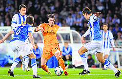 Real Madrids Gareth Bale is crowded by Real Sociedad players during their La Liga match at Anoeta Stadium in San Sebastian on Saturday night