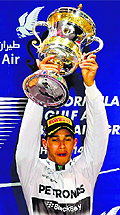 Lewis Hamilton celebrates his Bahrain Grand Prix win during the victory ceremony in Manama on Sunday