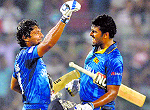 Kumara Sangakkara and Thisara Perera celebrate the win over India in the final. Sri Lanka beat India by six wickets