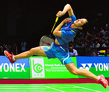 Shixian Wang beat world No. 1 Li Xuerui 22-20 21-19 in the womens final; and Lee Chong Wei (below) gestures to the crowd after winning the men's final against Chen Long in the India Open on Sunday
