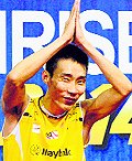 Lee Chong Wei gestures to the crowd after winning the men's final against Chen Long in the India Open on Sunday