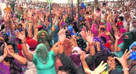 Members of the Jat community stage a dharna demanding reservation in government jobs.