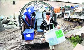 An Afghan worker of the election commission office unloads a ballot box from a truck in Jalalabad on Sunday.