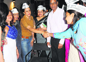 AAP candidate Gul Panag interacts with guests during a fund-raising event organised at Sector 26 in Chandigarh on Monday.