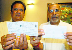 RS Nain (left) and A Sawhney show incorrect voter slips at the MDC, Panchkula, on Monday.