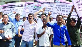 Activists of anti-Aam Aadmi Party group shout slogans during a demonstration under the banner of the Aam Aadmi Aandolan at the Nirman Vihar Metro station in New Delhi on Monday.