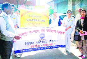 Students and senior citizens participate in a rally on World Health Day at Palampur on Monday