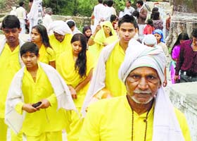 Followers of Dhyanu Bhagat on their way to the Bajjreshwari temple on Sunday