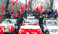 Members of the National Conference's youth wing hold a roadshow on the Gupkar road in Srinagar on Monday. 