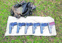 Arms recovered by the Army in Kunan village of Kupwara district on Monday.