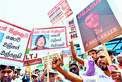 Pro-government activists protest outside the US embassy in Colombo
