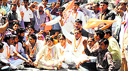 IBSP workers block the Kurukshetra-Dand road in Kurukshetra on Tuesday