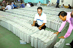 Poll staff arrange EVMs in Gurgaon on Tuesday