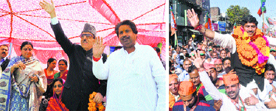JKPCC president Saifuddin Soz waves to his supporters during a poll rally in the Marh area of Jammu-Poonch constituency; BJP candidate Jugal Kishore Sharma leads a roadshow in Akhnoor on Tuesday. Tribune Photos: Anand Sharma. 