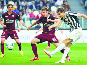Juventus Fernando Llorente shoots and scores a goal against Livorno during their Italian Serie A match in Turin on Monday.