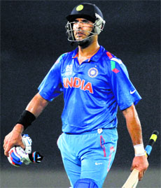 A shell-shocked Yuvraj returned to the pavilion after being dismissed in final