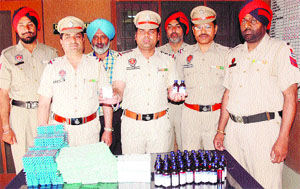 Police officials show the confiscated drugs in Amritsar on Wednesday.