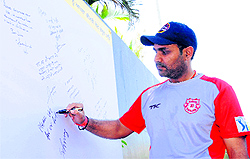 Kings XI Punjab player Virender Sehwag takes part in a signature campaign for creating voter awareness at the PCA stadium in Mohali on Wednesday