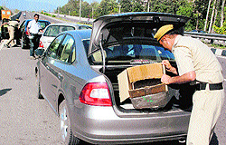 Policemen frisk vehicles on the Zirakpur-Kalka highway