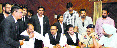 Lawyers exchange arguments with SDM-2 Paramjit Singh over the issue of non-acceptance of nomination papers of an independent candidate after the stipulated time in Jalandhar on Wednesday.