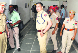 Police officials at the Zone-D office of the MC in Ludhiana. Tribune Photo: Himanshu Mahajan
