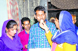 Jagjit Singh with his family at his house in Hoshiarpur on Tuesday.