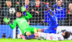 Chelsea striker Demba Ba (in blue) scores his teams second goal during the Champions League quarterfinal second leg match against Paris Saint-Germain in London on Tuesday night. AFP