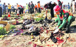 Rescue workers collect evidence at the site of a bomb blast at a vegetable and fruit market on the outskirts of Islamabad on Wednesday. Reuters
