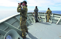 Australian security personnel on the lookout for the missing Malaysia Airlines flight in the southern Indian Ocean. Reuters