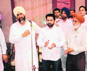 Manpreet Badal with state president of bus operators union Gurpreet Happy in Bathinda on Thursday.